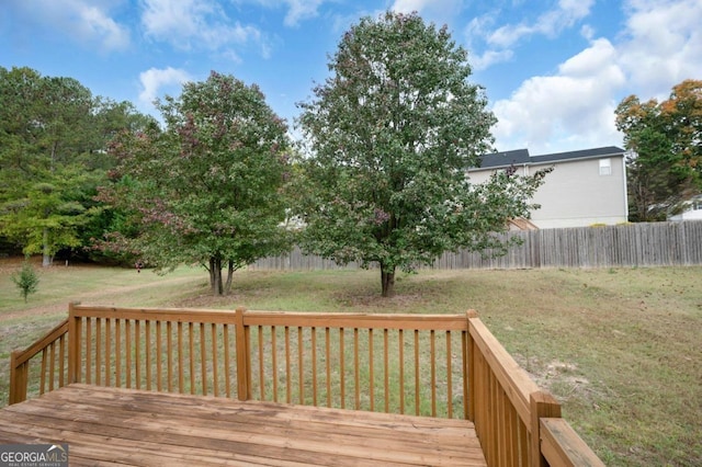 wooden deck with a yard