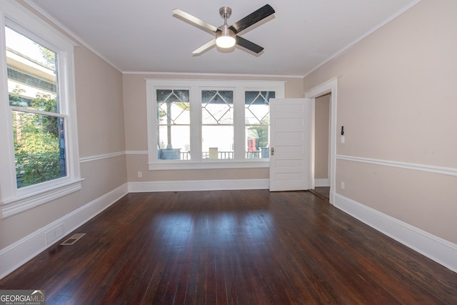 unfurnished room with crown molding, ceiling fan, and dark hardwood / wood-style flooring