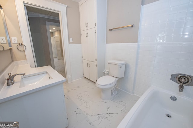 bathroom featuring a washtub, toilet, tile walls, vanity, and crown molding