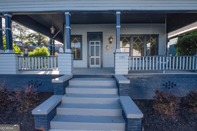 doorway to property with a porch