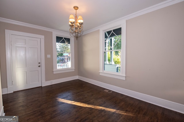 interior space with a wealth of natural light, crown molding, and dark hardwood / wood-style flooring