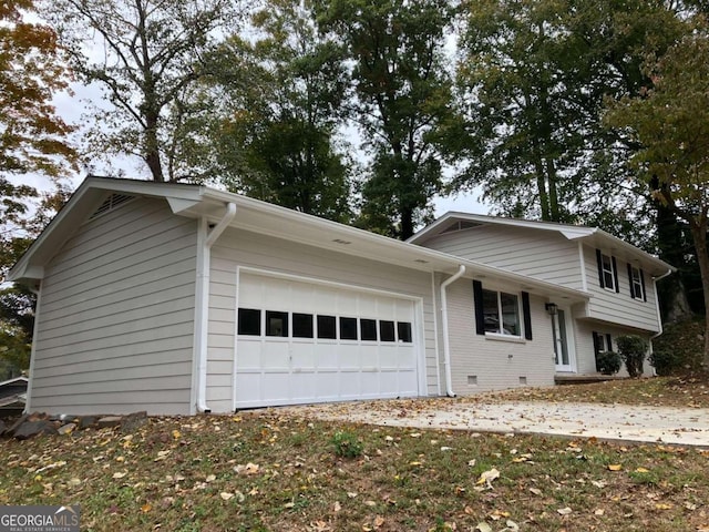 3666 Elkridge Dr, Decatur, GA 30032 - tri-level home featuring an attached garage and brick siding