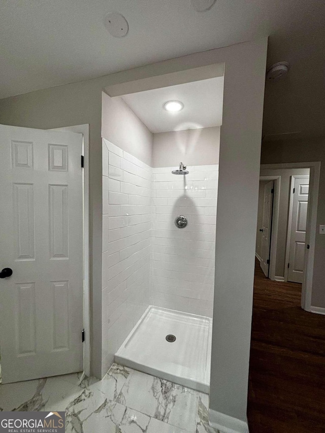 3666 Elkridge Dr, Decatur, GA 30032 - bathroom with baseboards, marble finish floor, and tiled shower