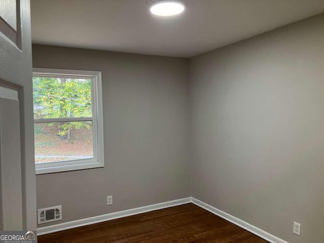 3666 Elkridge Dr, Decatur, GA 30032 - spare room featuring baseboards, dark wood-style floors, and visible vents