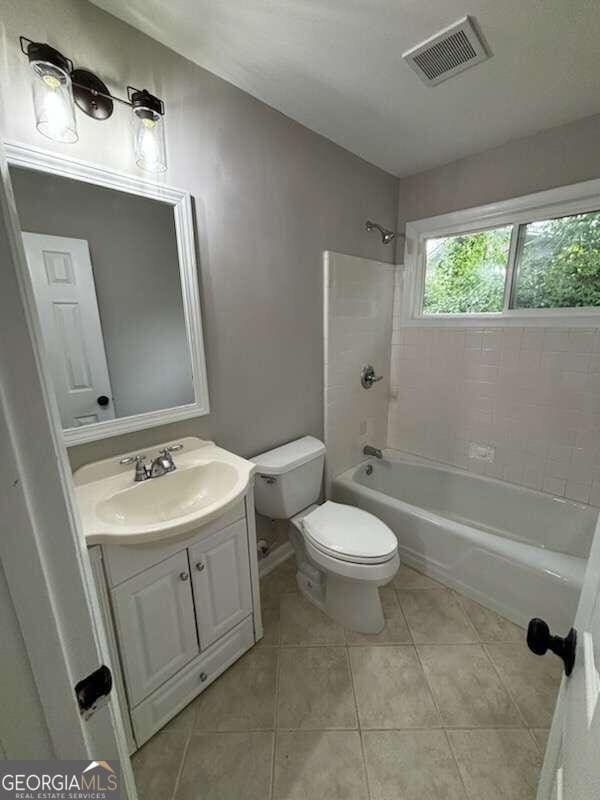 3666 Elkridge Dr, Decatur, GA 30032 - full bath with tile patterned flooring, bathtub / shower combination, vanity, toilet, and visible vents