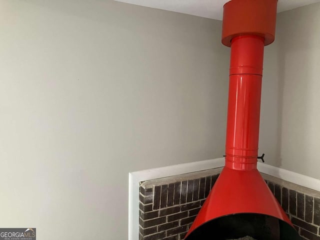 3666 Elkridge Dr, Decatur, GA 30032 - interior details with baseboards and a wood stove