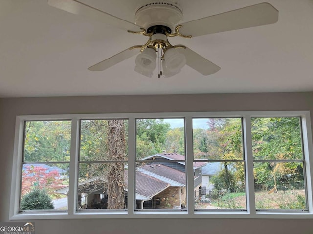 interior details featuring ceiling fan