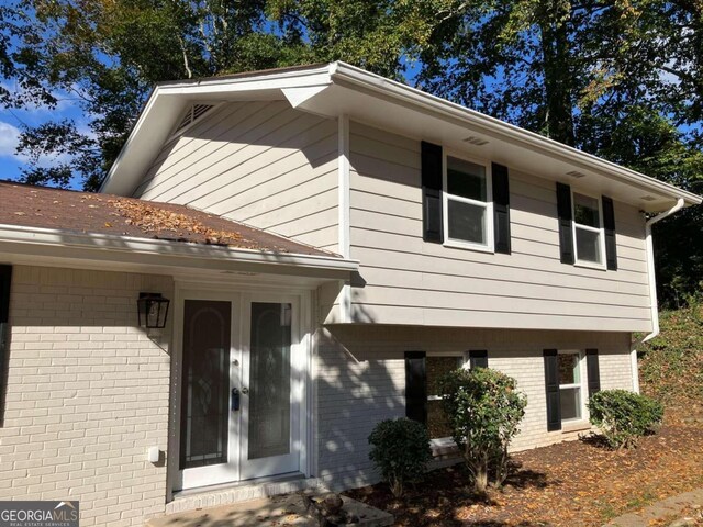 3666 Elkridge Dr, Decatur, GA 30032 - tri-level home with french doors and brick siding