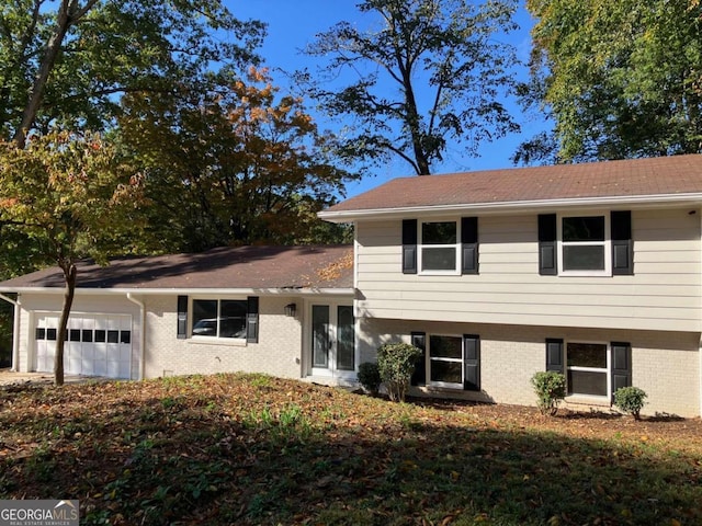 3666 Elkridge Dr, Decatur, GA 30032 - split level home featuring brick siding and an attached garage