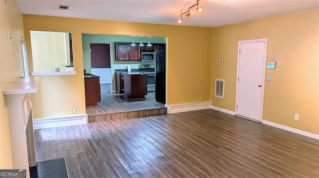 unfurnished living room featuring dark hardwood / wood-style flooring