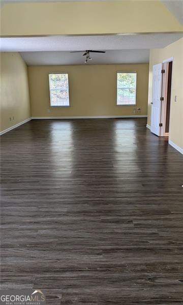 unfurnished room with dark hardwood / wood-style floors