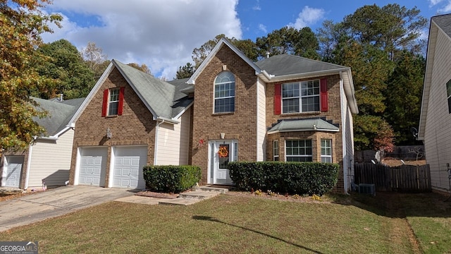 view of front of property featuring a garage and a front yard