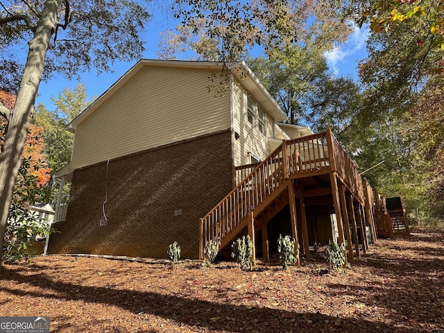 view of side of home featuring a deck