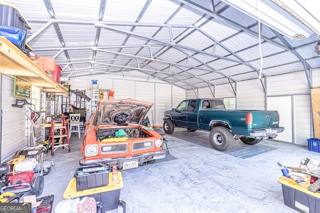 garage featuring wood walls