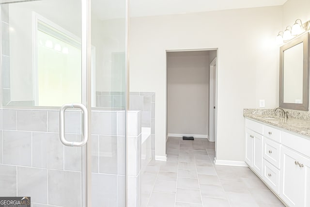 bathroom featuring vanity, independent shower and bath, and tile patterned flooring