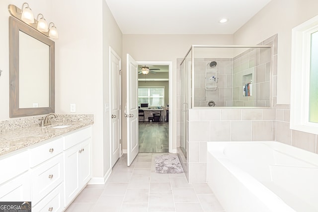 bathroom with vanity, tile patterned floors, separate shower and tub, and ceiling fan