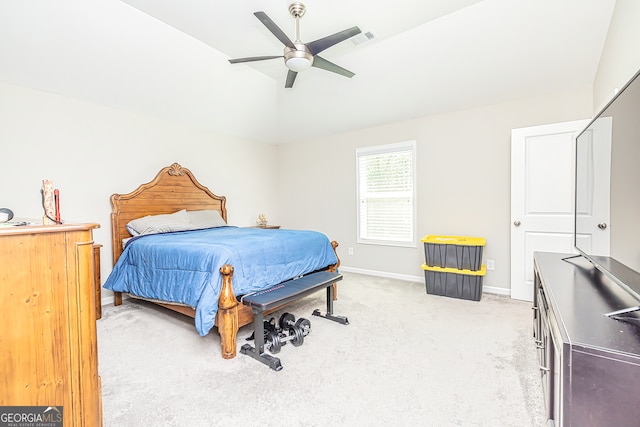 bedroom with lofted ceiling, light colored carpet, and ceiling fan