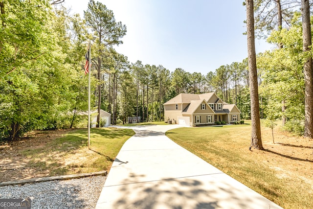 view of front facade featuring a front lawn and a garage