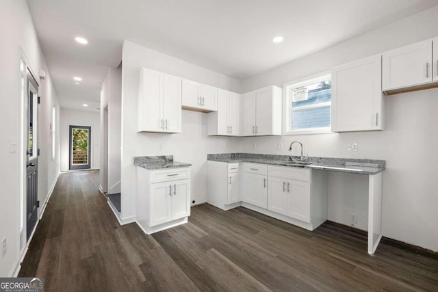 kitchen featuring white cabinets, dark hardwood / wood-style floors, and a healthy amount of sunlight