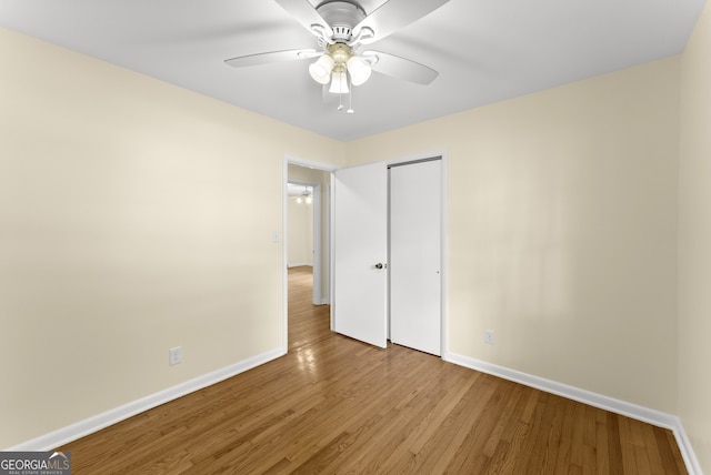 unfurnished bedroom featuring light hardwood / wood-style flooring and ceiling fan