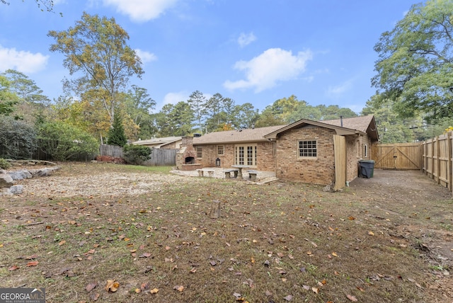 rear view of property featuring a patio area