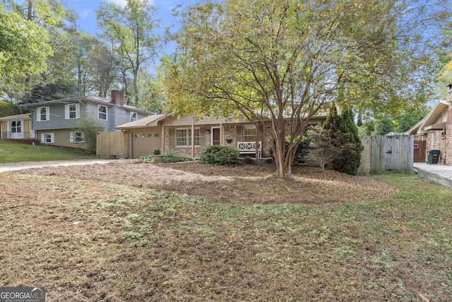 view of front of property featuring a porch and a garage