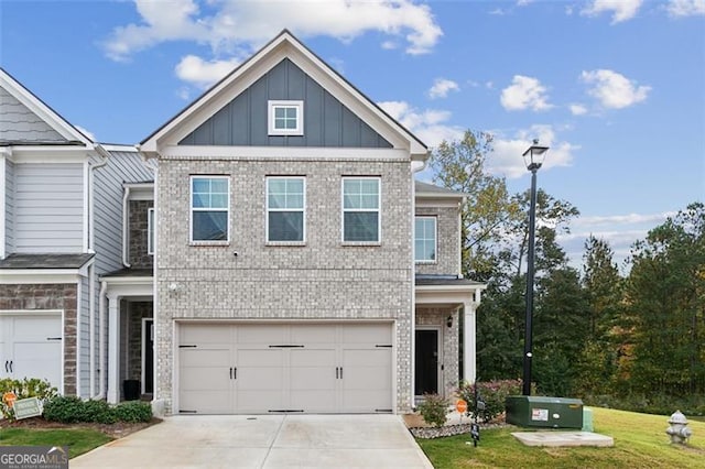 view of front of house with a front lawn and a garage