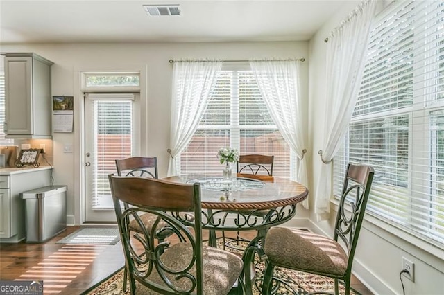 dining space with light wood-type flooring