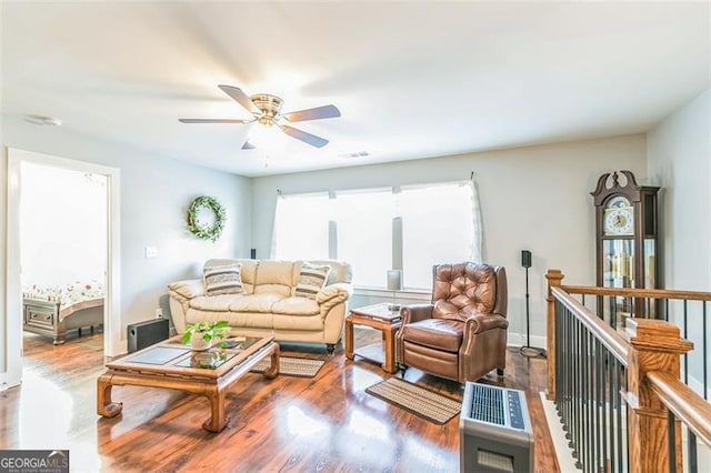 living room with hardwood / wood-style flooring and ceiling fan