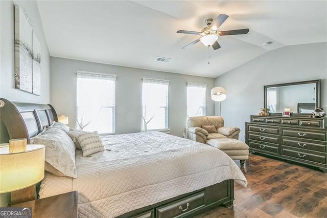 bedroom featuring lofted ceiling, ceiling fan, and dark hardwood / wood-style flooring