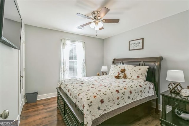 bedroom featuring ceiling fan and dark hardwood / wood-style flooring