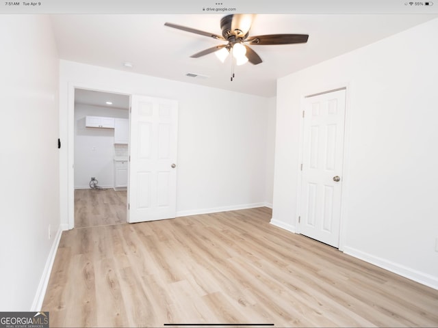 3363 Delmar Ln NW, Atlanta, GA 30331 - spare room featuring a ceiling fan, light wood finished floors, and baseboards