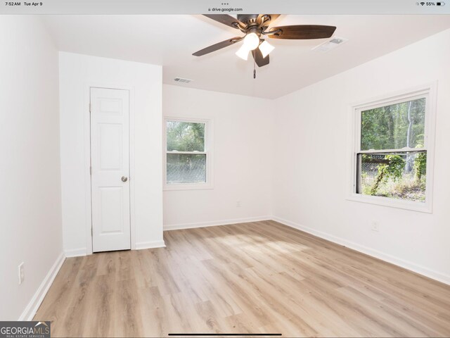 3363 Delmar Ln NW, Atlanta, GA 30331 - spare room with light wood finished floors, a ceiling fan, and baseboards