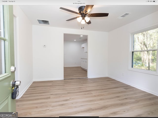 3363 Delmar Ln NW, Atlanta, GA 30331 - unfurnished room featuring ceiling fan, light wood finished floors, and baseboards