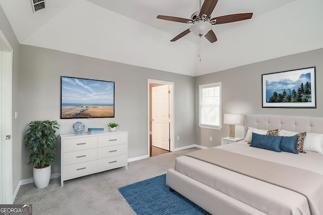 bedroom featuring ceiling fan, light colored carpet, and vaulted ceiling