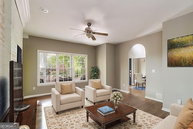 living room with ceiling fan and hardwood / wood-style flooring