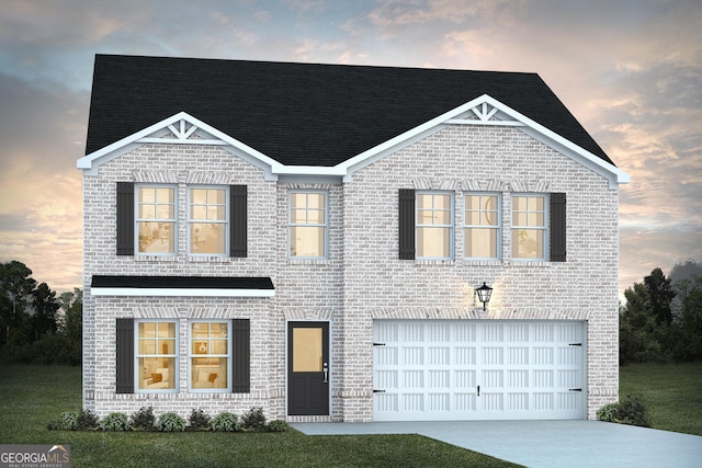 view of front facade featuring a yard and a garage