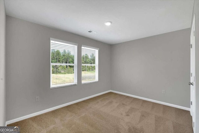 view of carpeted spare room