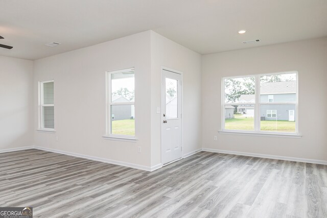 foyer featuring ceiling fan, light hardwood / wood-style flooring, and plenty of natural light