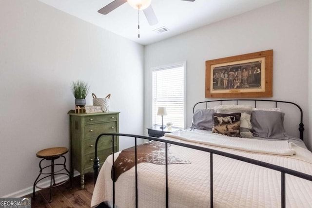 bedroom featuring ceiling fan and dark wood-type flooring