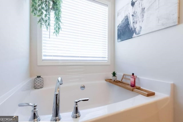 bathroom featuring a tub to relax in