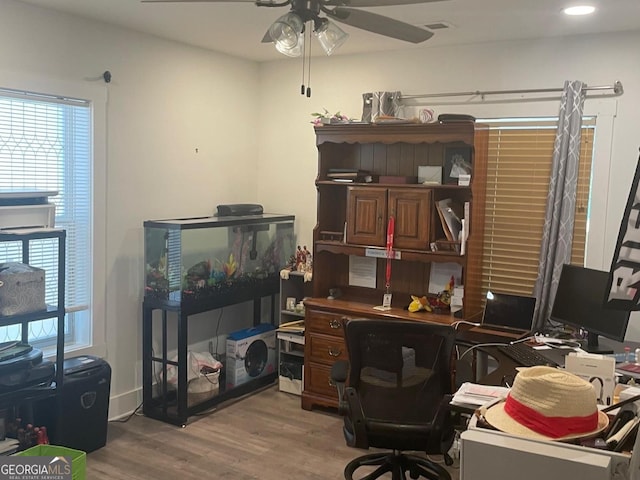 office area with ceiling fan and hardwood / wood-style flooring