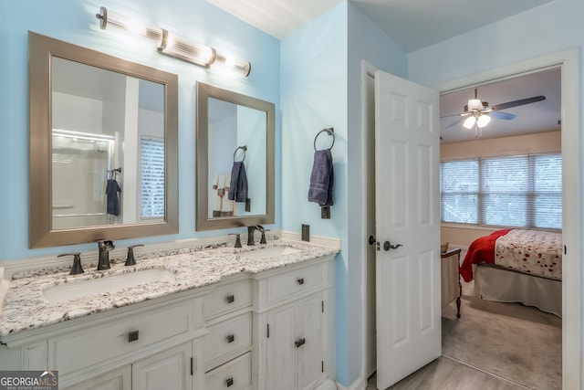 bathroom featuring vanity and ceiling fan