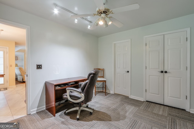 office space featuring ceiling fan and light tile patterned flooring