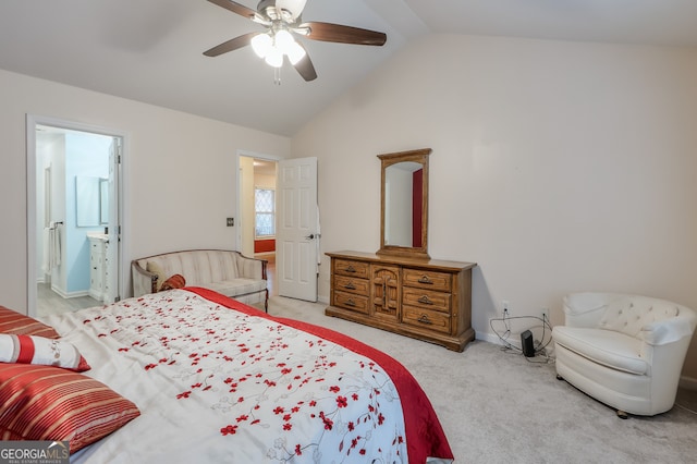 carpeted bedroom with connected bathroom, lofted ceiling, and ceiling fan