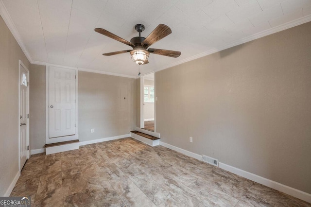 empty room with ornamental molding and ceiling fan