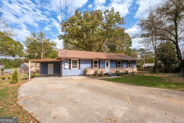 ranch-style home featuring a carport