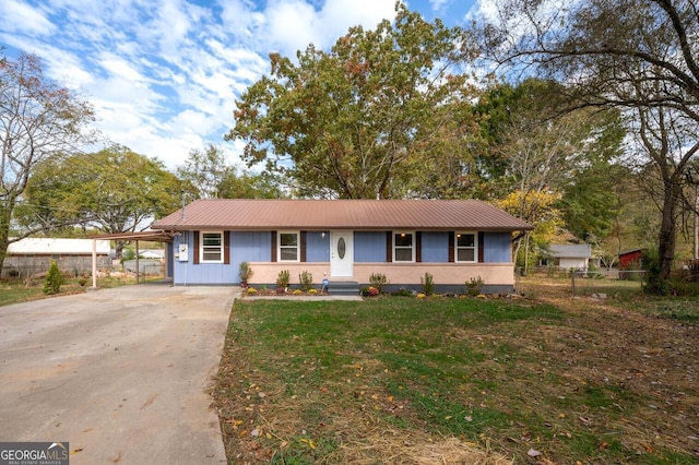 ranch-style house featuring a carport