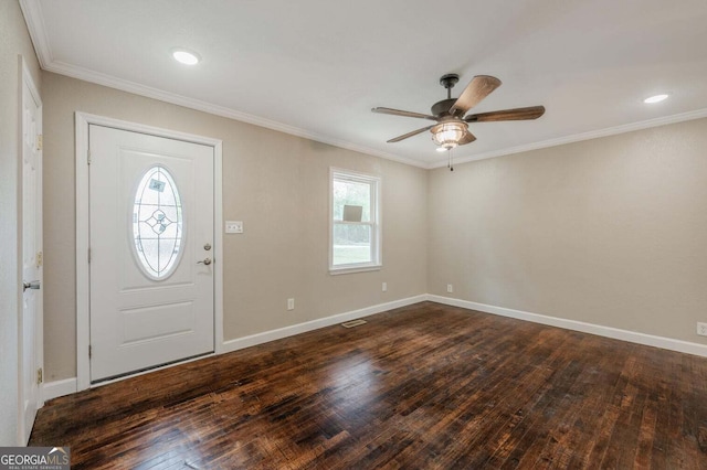 entryway with ornamental molding, dark hardwood / wood-style floors, and ceiling fan