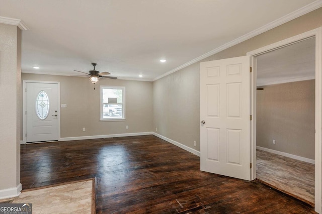 foyer entrance featuring ceiling fan, ornamental molding, and dark hardwood / wood-style flooring